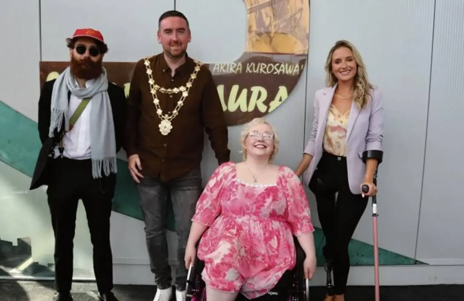 Strange Wolves representatives with Ella Heatley-Mulhall at a Galway community event